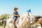 Child visiting horse ranch