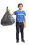 Child volunteer holding a waste bag