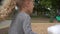 Child walk with candyfloss in amusement park. Girl enjoys cotton candy. Gimbal