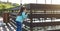 child for a walk. A cute little girl walks on a wooden pier by the river