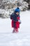 Child walking on snow