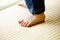 Child walking on tatami in japanese house.