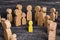 The child was lost in the crowd. A crowd of wooden figures