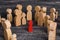 The child was lost in the crowd. A crowd of wooden figures of people surround a lost child. Lost kids
