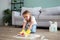 The child washes the floors of the house. The concept of child labor. The assistant