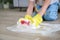 The child washes the floors of the house. The concept of child labor. The assistant