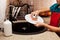 Child washing a plate with sponge at the kitchen sink, shallow d