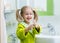 Child washing and showing soapy hands