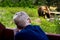 Child watching Big Brown Bear in a zoo. Dangerous, friendly