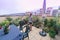 child watering flowers in huge terrace full of flowers