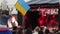 Child waving of flag Ukraine, little girl at concert, patriotic upbringing kid, concert crowd on rock festival,