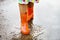 Child wearing orange rain boots