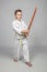 Child who practices martial arts and uses a wooden bokken