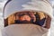 A child in winter clothes sleeps lying in a baby carriage , face close-up, age 8 months