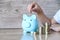 Child woman hand hold pink piggy bank for saving money for education study or investment , Save money concept