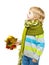 Child in woolen scarf holding maple leaves