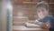 Child working in the classroom surrounded by animation of bokeh effect