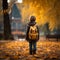 Childhood adventure Little boy with backpack explores autumn park