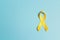 Childhood Cancer Awareness Yellow Ribbon on blue background