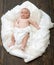 Childhood and Divine gift concept. Infant covered with white blanket