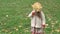 Childhood, family, autumn concept - small blonde girl with loose long hair 3-4 years old in orange beret holding in hand