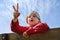 Childhood leisure happy boy kid playing rock-paper-scissors game in park