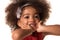 Childhood and people concept- cute african american girl touches her cheeks, isolated