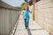 Childhood play. Happy boy have fun running on promenade. Outdoor play. Summer activities