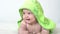 Childhood, daily routine, hygiene infant concepts - Close-up Happy kid colored towel of green frog on white background
