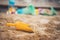 Childhood sandbox concept: Close up of plastic toy shovel