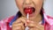 Childish girl biting sweet lollipop, effect of sugar on teeth, diabetics risk