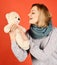 Childish mood concept. Woman holds teddy bear