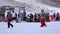 Children and adults engaged in winter sports in the ski lodge Riding on mo