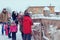 Children and adults people look at animals on a rural farm - Moscow, Russia, 01 04 2019