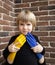 Children against war. female hands, painted in yellow and blue, embrace and protect a child, a son