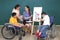 Children with Asian disabilities or autistic children are training their hand and finger muscles by painting with water. With the