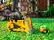 Children baby toys tractor and truck in the beautiful garden forest playground outdoor