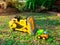 Children baby toys tractor and truck in the beautiful garden forest playground outdoor