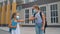 Children back to school in safety masks. Two girls, after being isolated from the covid-19 virus, greet with their