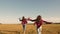 Children on background of sun with an airplane in hand. Dreams of flying. Happy childhood concept. Two girls play with a