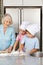 Children baking cookies with grandmother