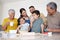 Children, baking and family with a boy tasting flour while learning to bake in the kitchen with parents, grandparents