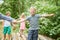 Children balance on tree trunks