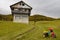 Children bike near unfinished house