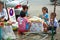 Children are binding flowers at the flower market in Bangkok