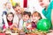 Children at birthday party with muffins and cake