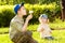 Children blowing dandelions