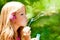 Children blowing soap bubbles in outdoor forest