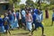 Children in blue lineup at school near Tsavo National Park, Kenya, Africa