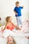 Children Bouncing On Bed